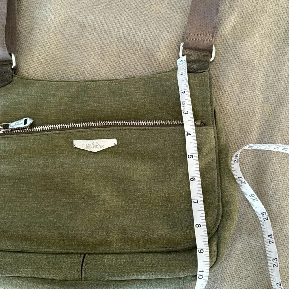 Kipling moss green with colbalt blue lining crossbody bag